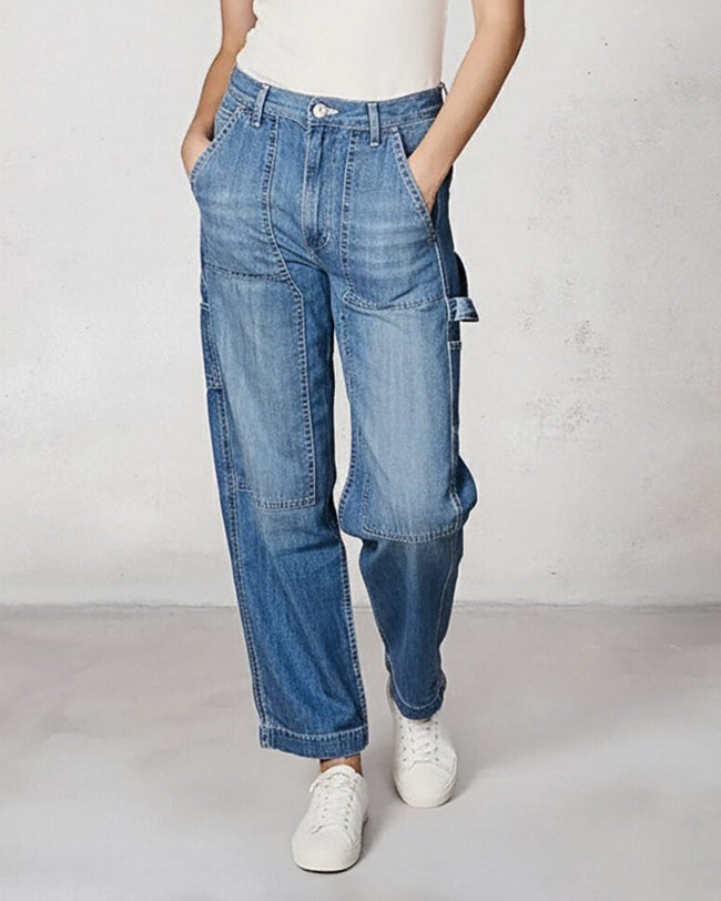 Light blue denim utility pants with cargo pockets and cuffed hem