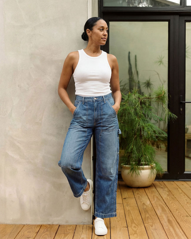 Blue denim utility pants with wide leg, side cargo pocket details and belt loops