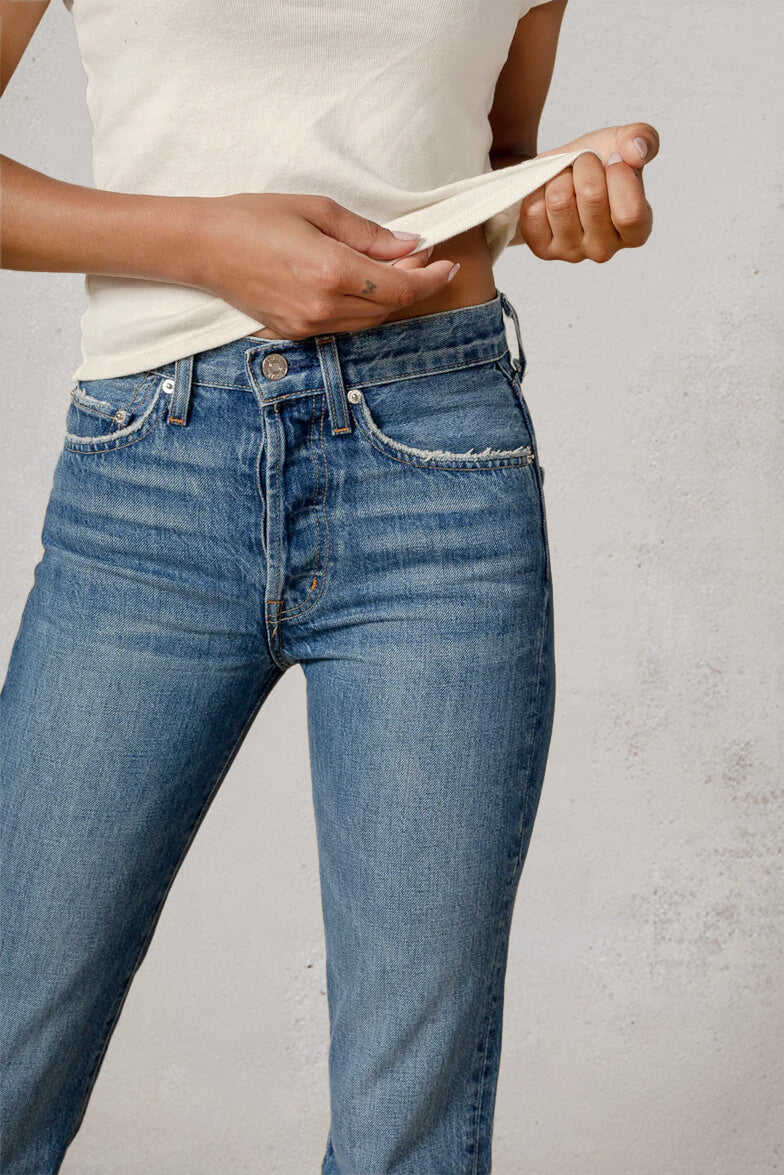 Discover the CAI in Lumineer, a stylish high-rise women's jean featuring a classic straight leg and relaxed silhouette, designed for ultimate comfort and versatility.