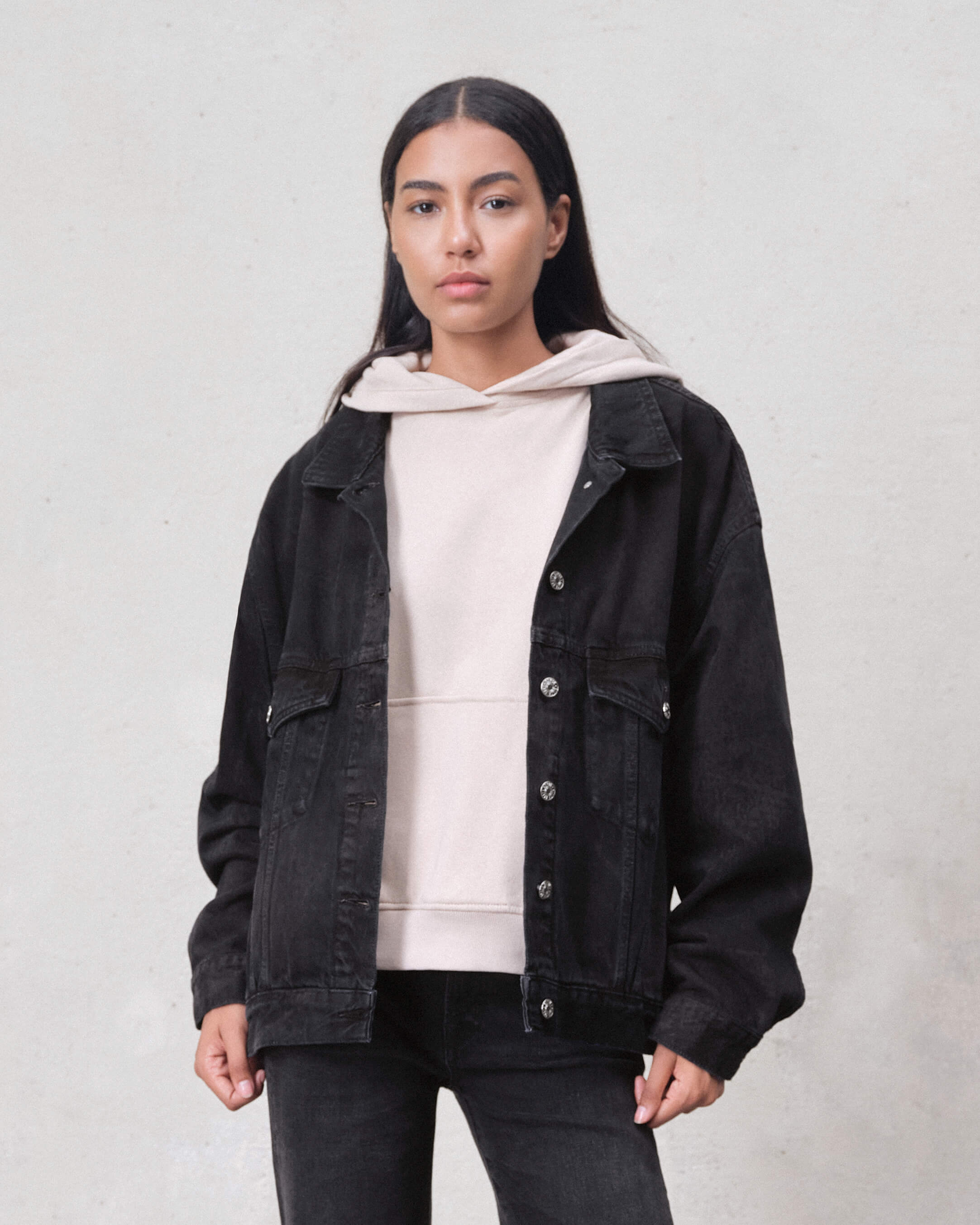 Shop EDWIN USA's oversized trucker jacket for women in carbon black, combining bold style with comfortable fit for everyday wear.
