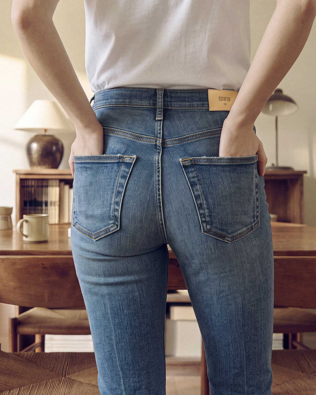 Karma cropped bootcut jeans back view, medium-blue denim, two patch pockets, belt loops