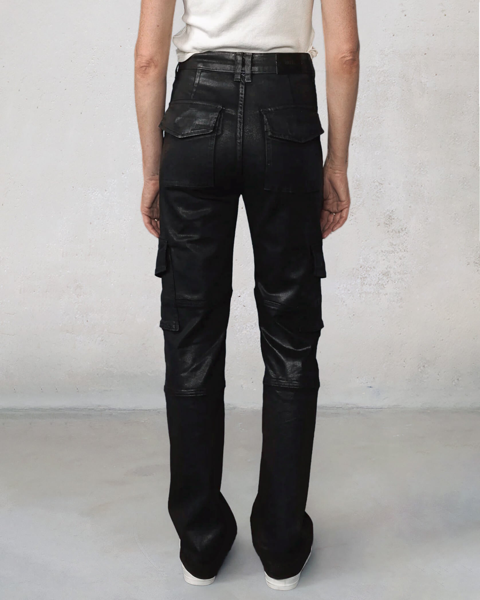 Elevate your style with the Keegan Cargo Pant in coated black. Perfect for work or play, these versatile pants transition effortlessly from day to night.