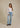 Discover the Marli Wide Leg Crosby, a stylish high-rise denim pant that flatters your waist and hips while offering a relaxed fit for effortless casual elegance.