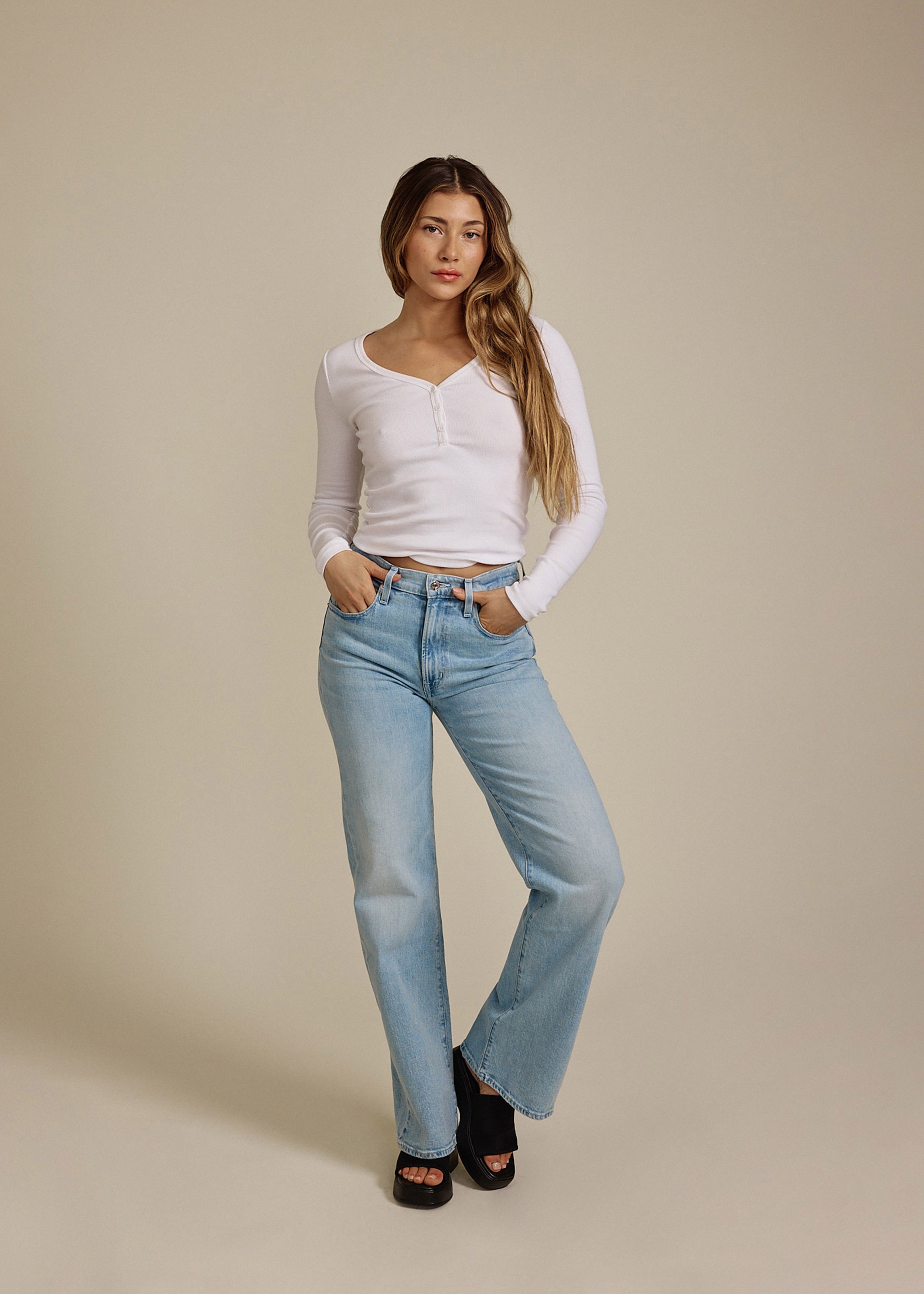 Discover the Marli Wide Leg Crosby, a stylish high-rise denim pant that flatters your waist and hips while offering a relaxed fit for effortless casual elegance.