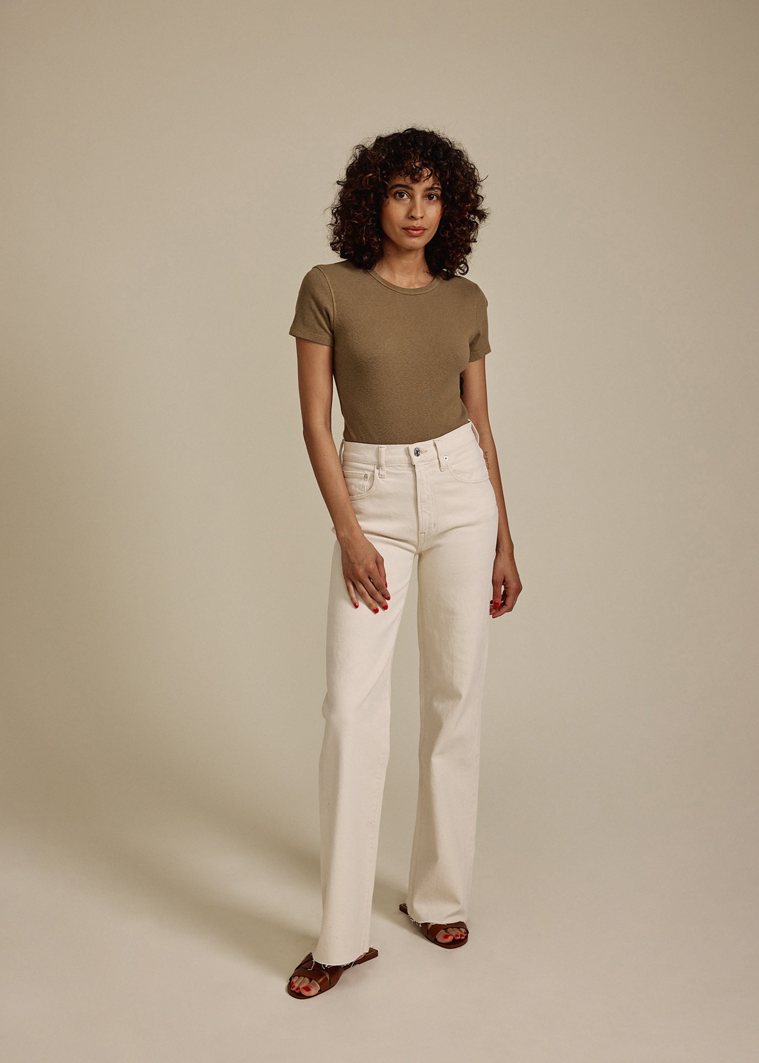 Elevate your style with the Marli Wide Leg jeans in Parchment. Featuring a high rise and chic raw hem, these jeans offer a flattering fit and effortless elegance.