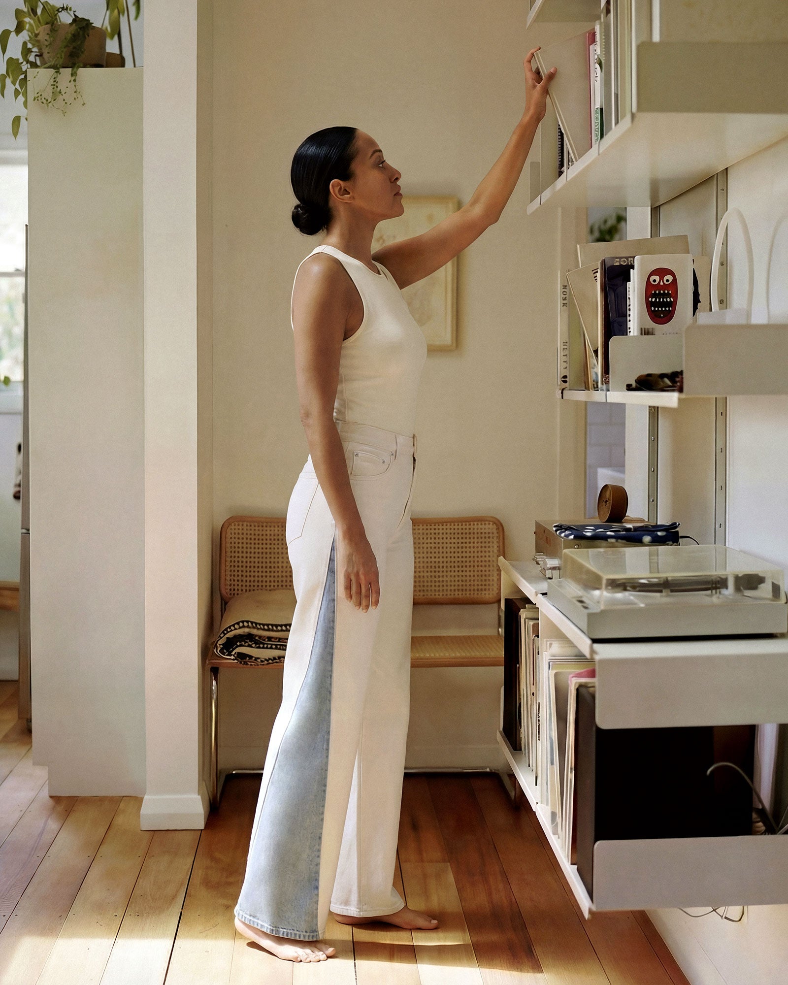 White body with light indigo panel inserts at the outseam. The contrast is clearest in natural outdoor light, where the difference between the two fabrics is most visible.