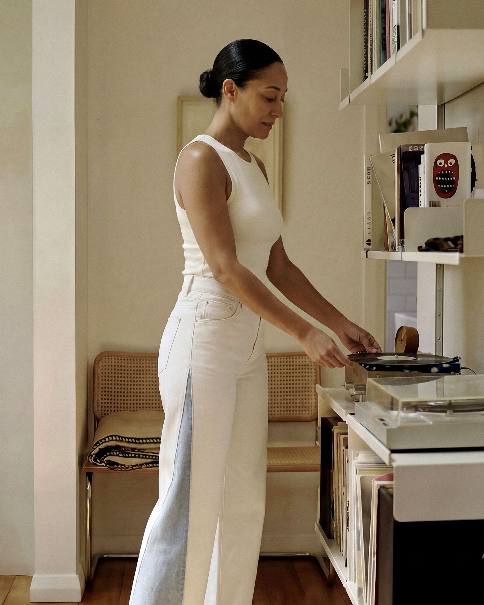 White body with light indigo panel inserts at the outseam. The contrast is clearest in natural outdoor light, where the difference between the two fabrics is most visible.