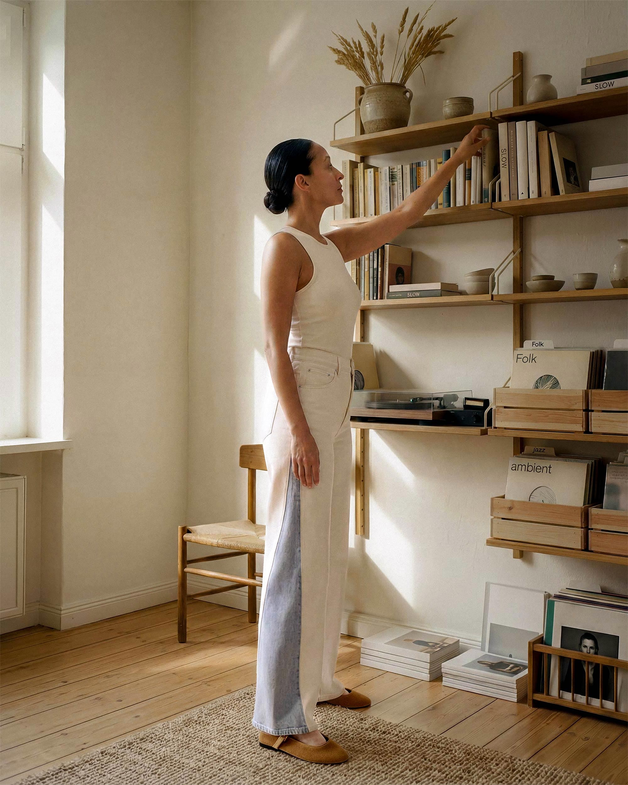 White body with light indigo panel inserts at the outseam. The contrast is clearest in natural outdoor light, where the difference between the two fabrics is most visible.