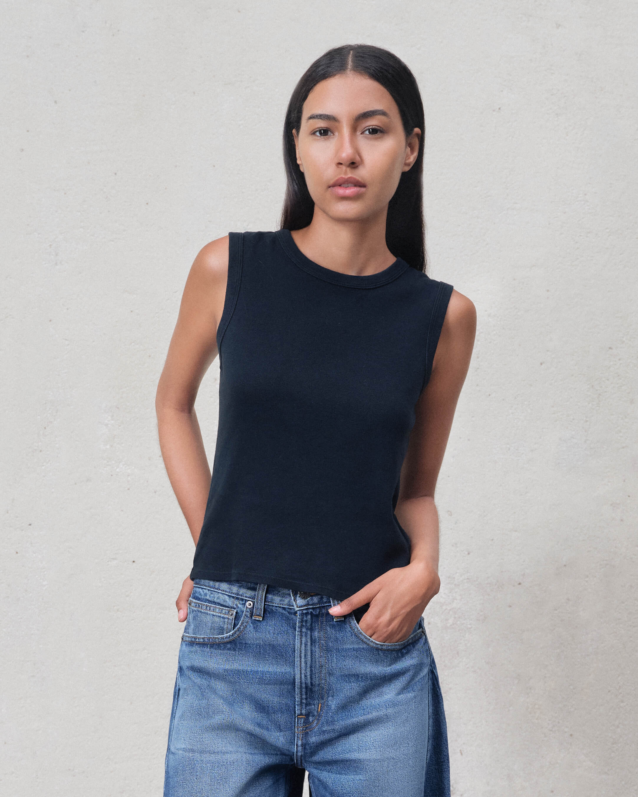 Elevate your style with our Vintage Black Muscle Tank. Crafted from premium ribbed cotton, it features a relaxed fit and timeless design for versatile everyday wear.