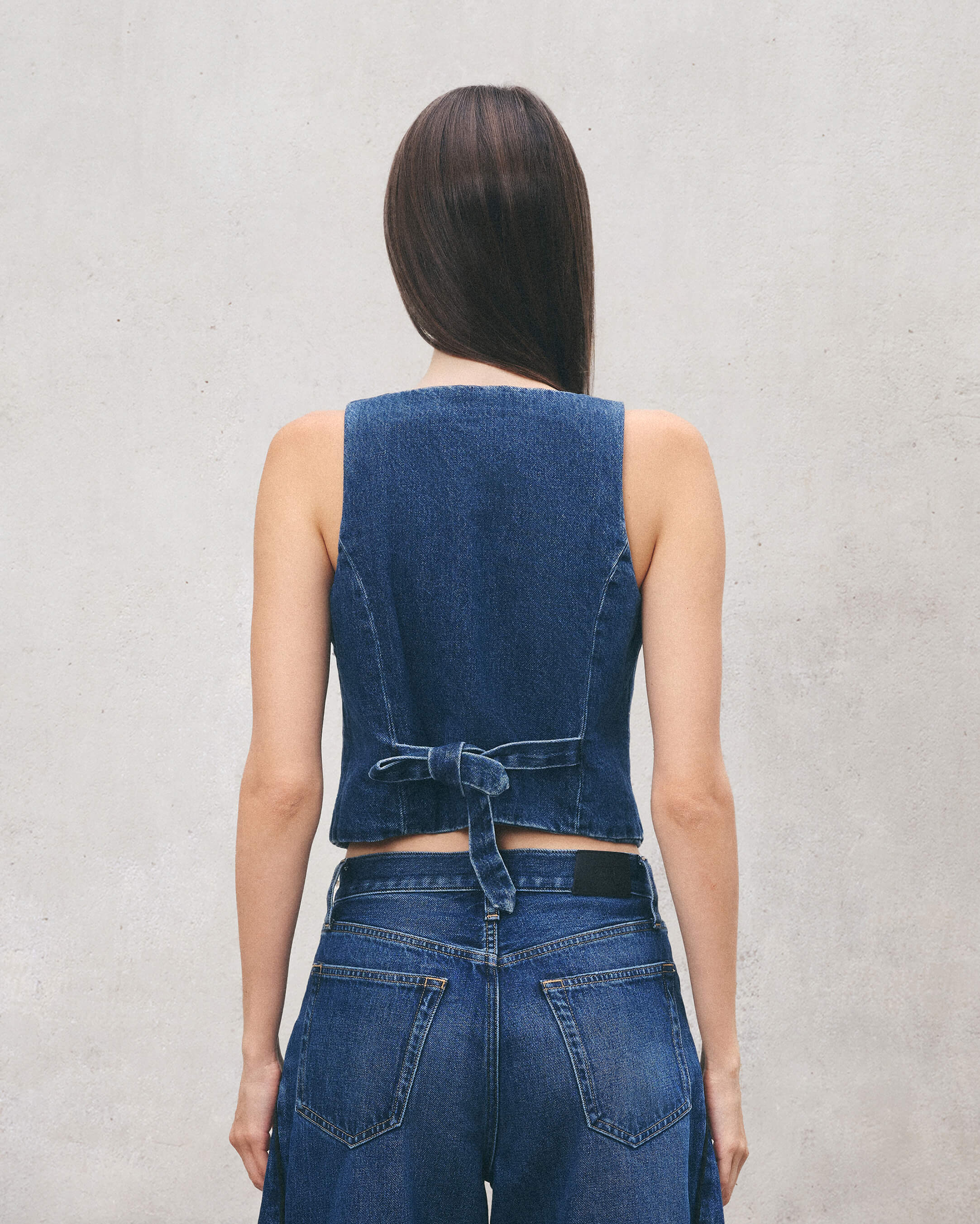 Shop the Nelly Vest Rosen for women at EDWIN USA, a stylish denim vest with a flattering fit and button-front detail. Perfect for a chic casual look.