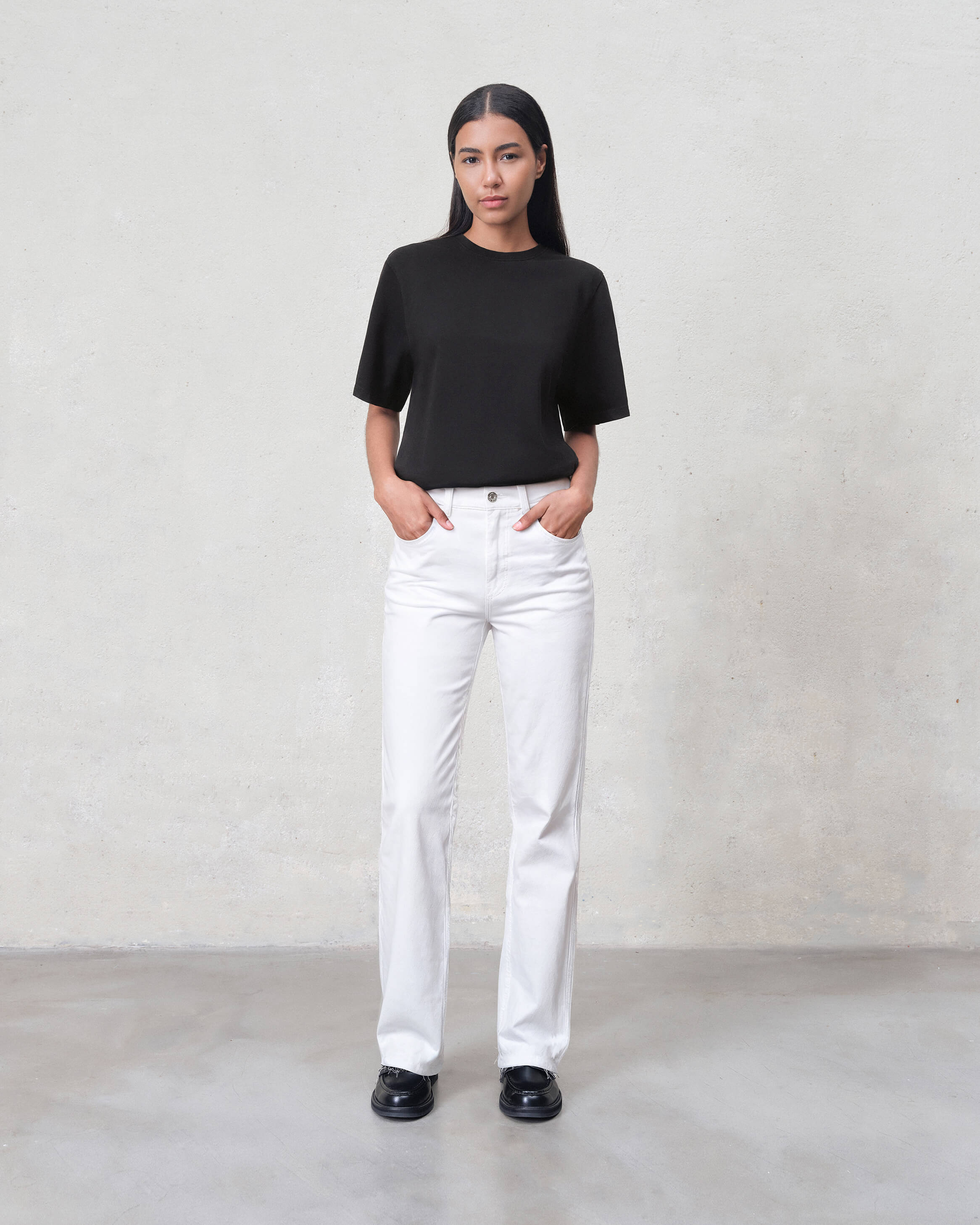 Elevate your style with the Marli Wide Leg jeans in Parchment. Featuring a high rise and chic raw hem, these jeans offer a flattering fit and effortless elegance.