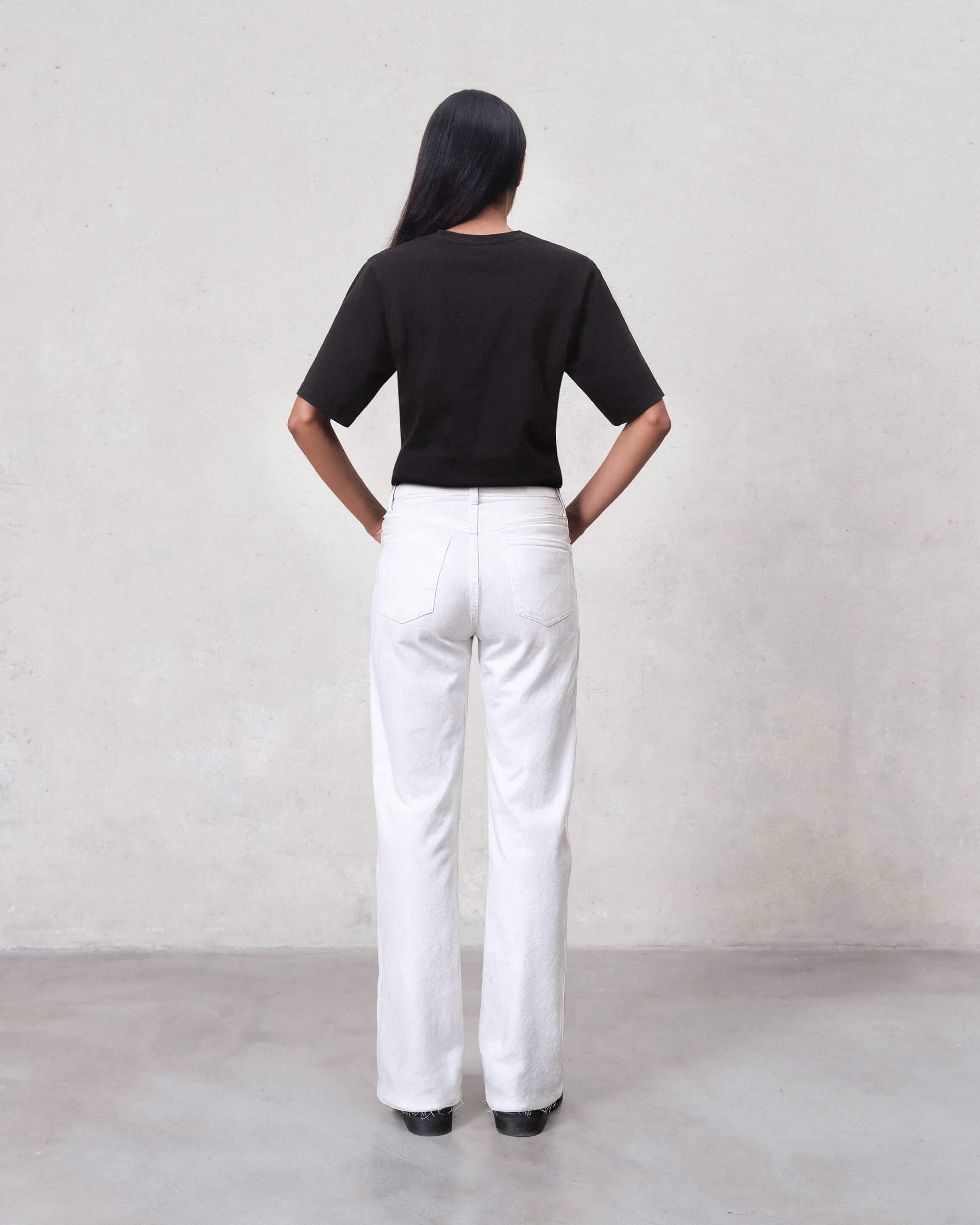 Elevate your style with the Marli Wide Leg jeans in Parchment. Featuring a high rise and chic raw hem, these jeans offer a flattering fit and effortless elegance.