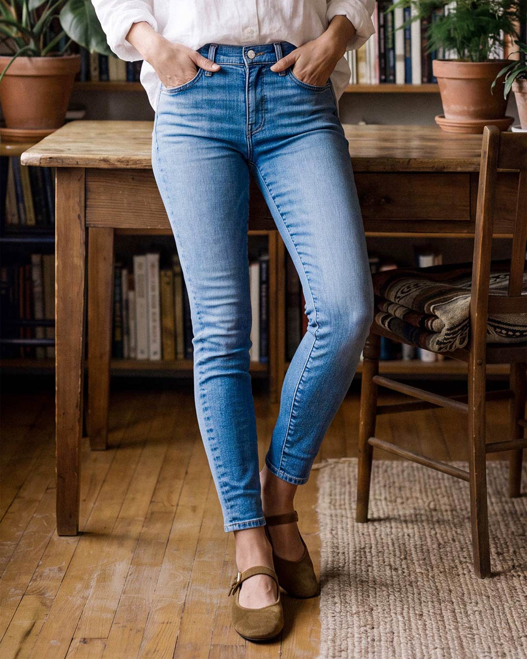 The PIXIE is a women's mid-rise skinny jean with an ultramodern silhouette. It sits just below the waist and features a super skinny fit from hip to ankle. In a clean, dark indigo wash with a natural whisker pattern.