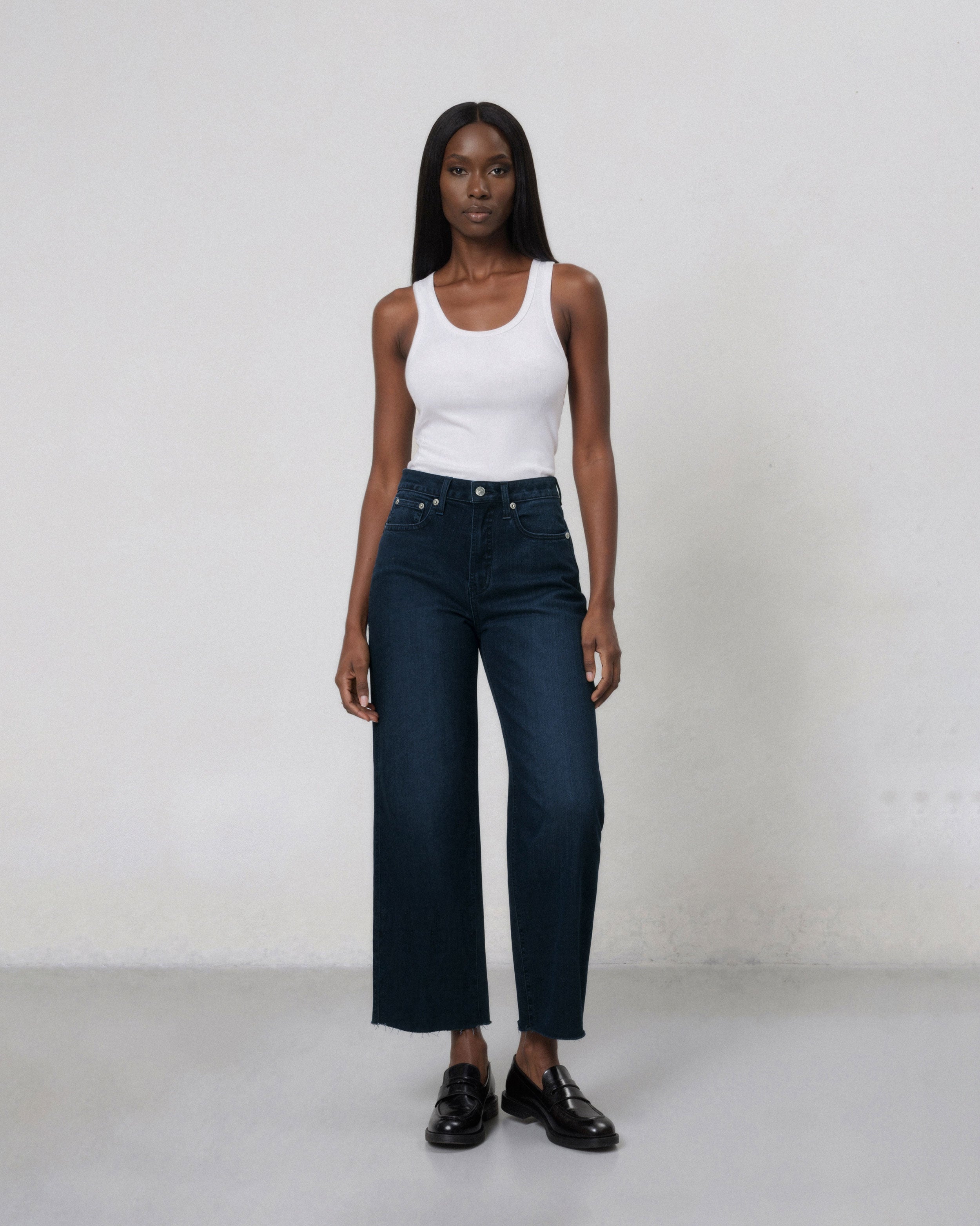 Marli Wide Leg Ankle With Raw Hem in Pebble, featuring a flattering high-rise fit that hugs your waist and hips, then flows into a stylish wide leg design.