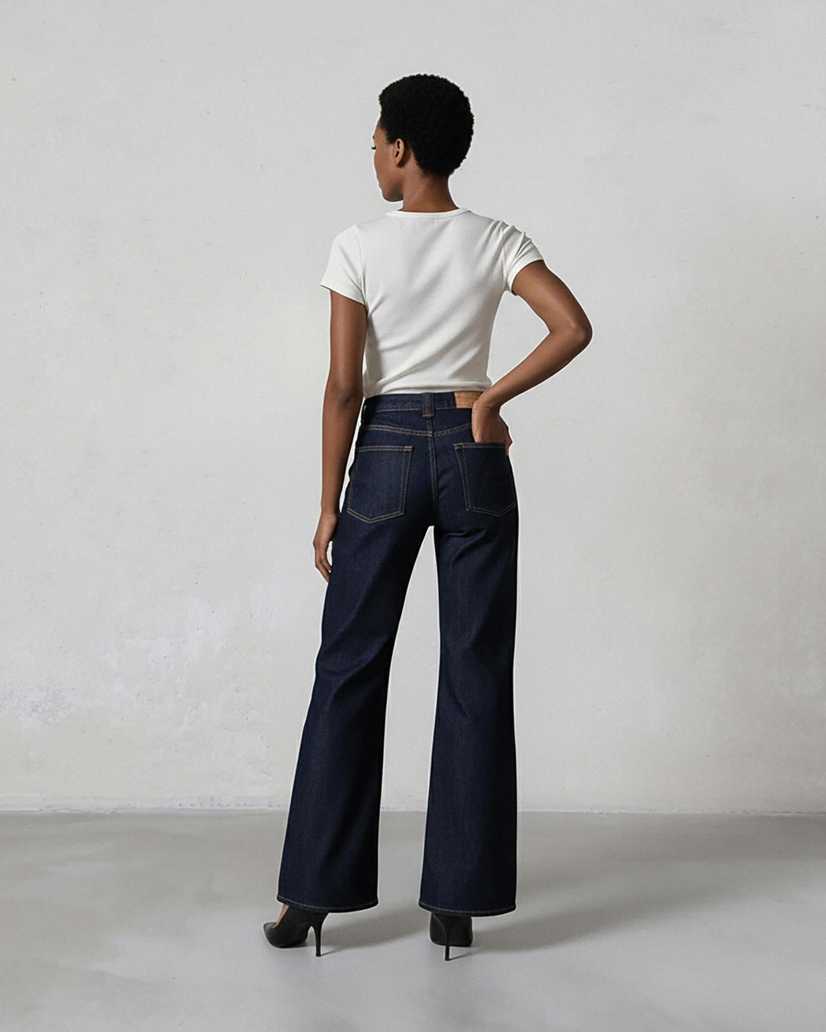 Discover the Rowan Wide Leg Rinse jeans, featuring a vintage-inspired design, ultra high rise, and a flattering fit that sits perfectly at the natural waistline.