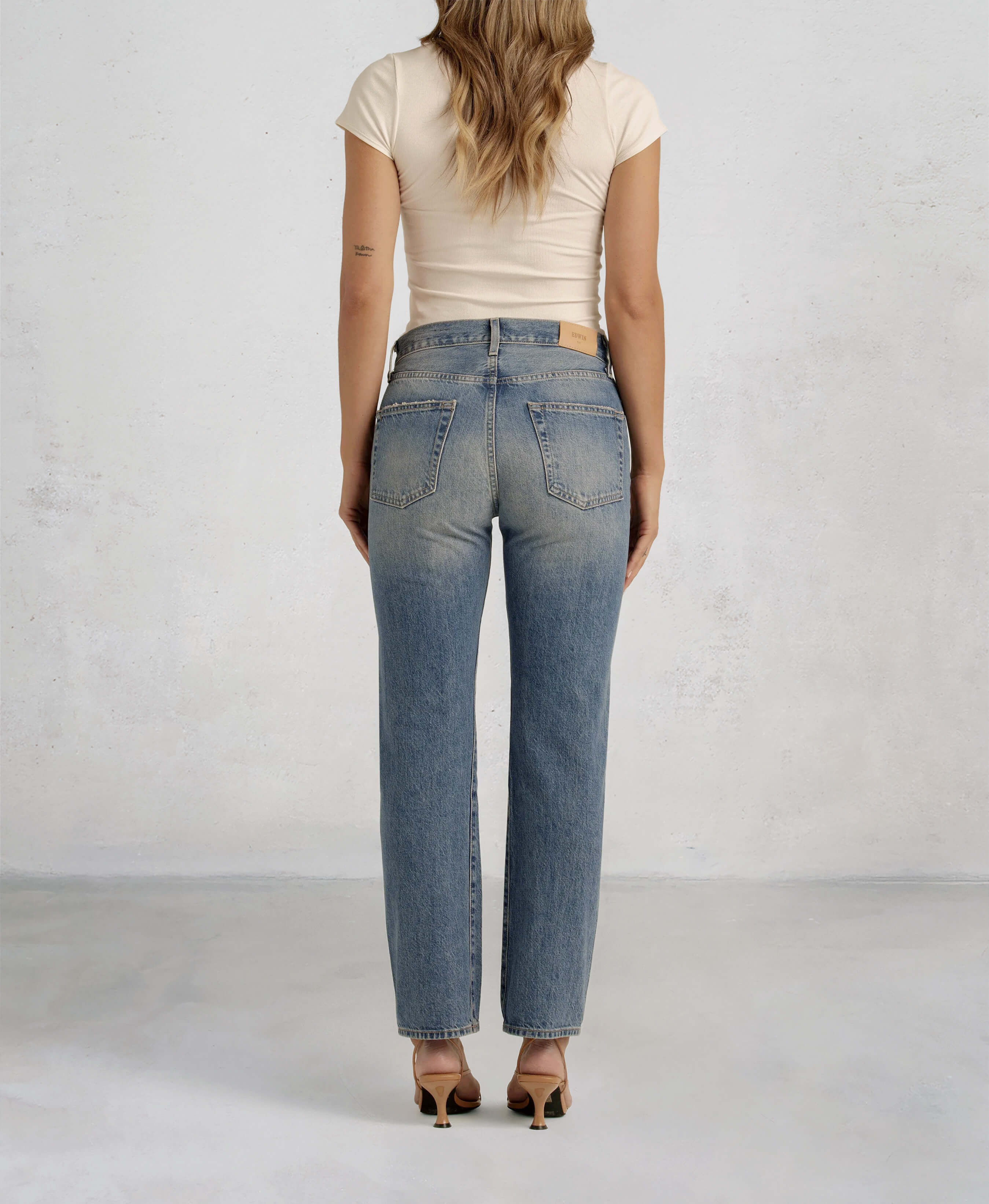 Discover the TASH, a relaxed '90s jean designed for a laid-back vibe. With a straight leg and low-slung fit, it’s perfect for a stylish, boyish look this summer.
