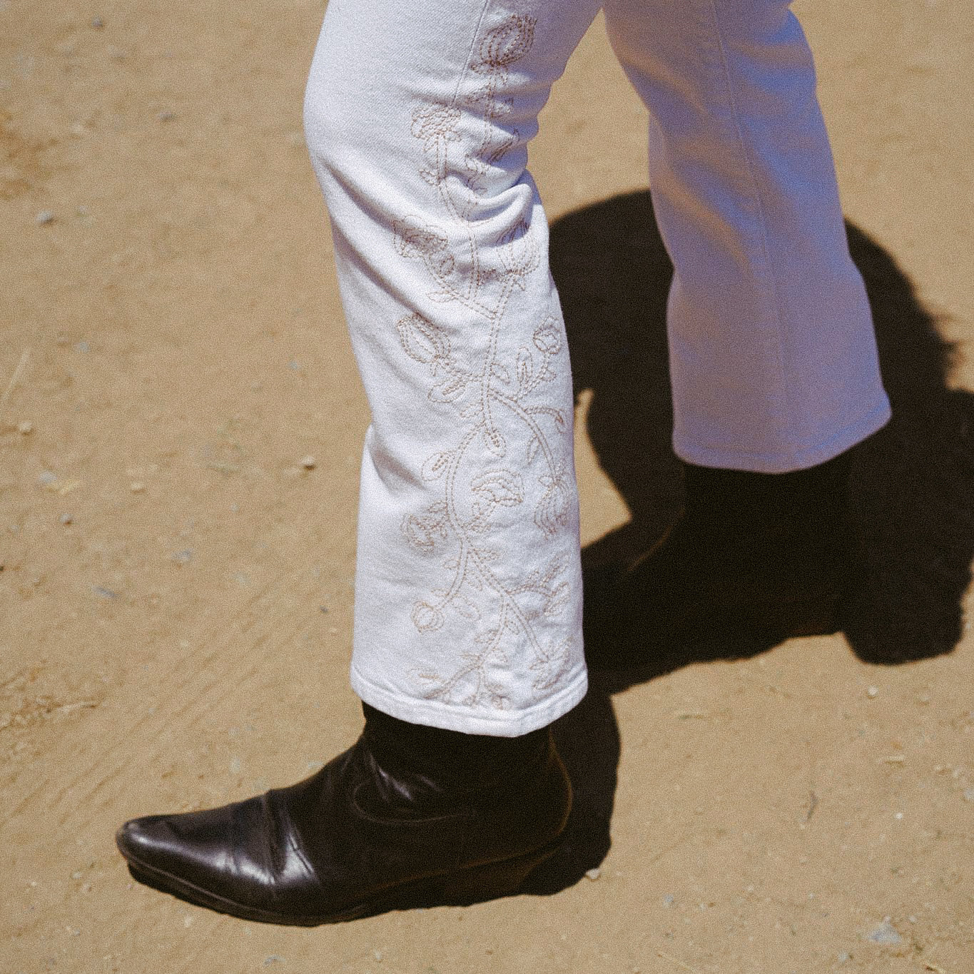 Discover the Lark Ankle Boot Cut in eggshell with stunning embroidery. This mid-rise, micro-bootcut jean offers a stylish fit for any occasion. Elevate your wardrobe!