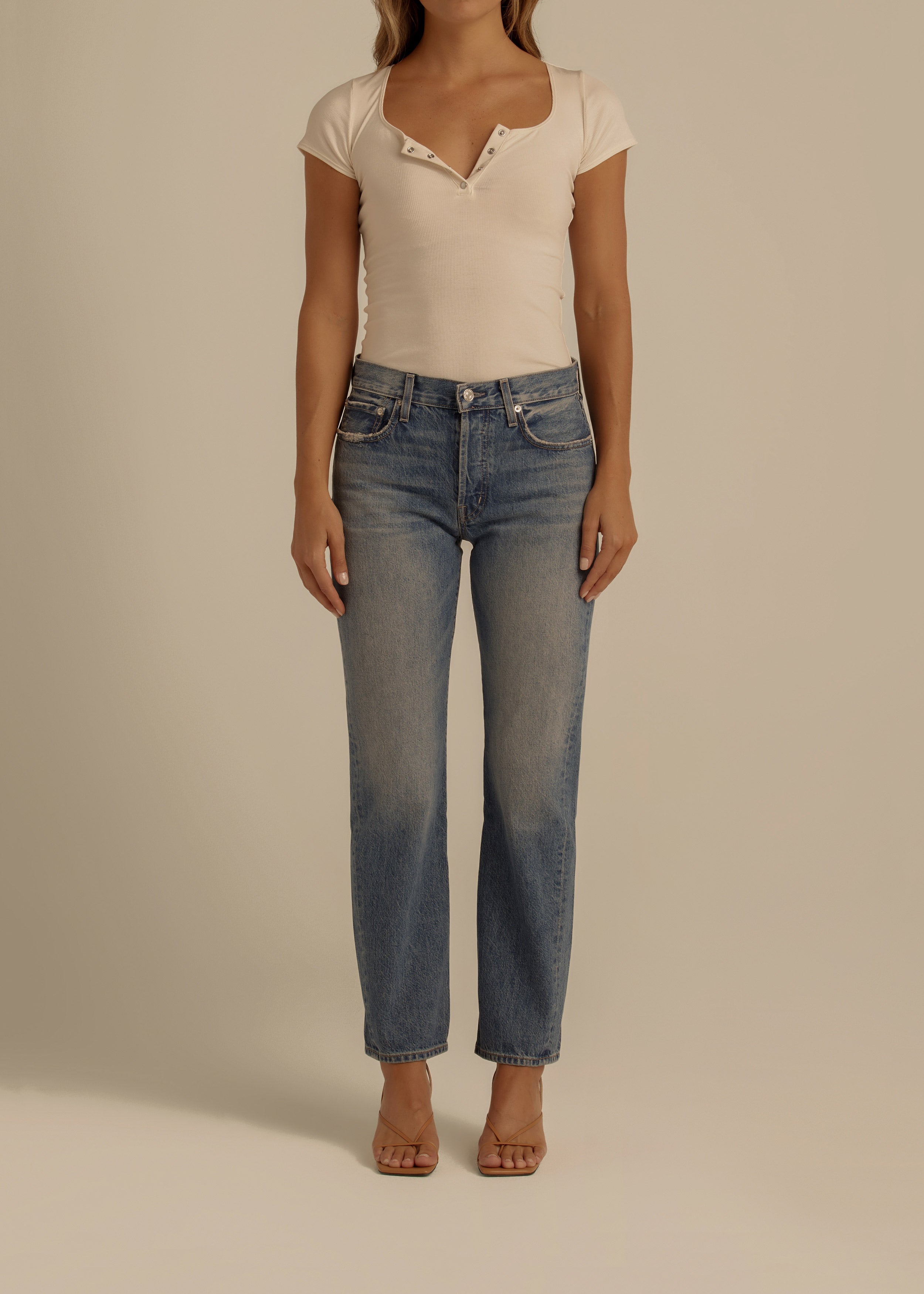 Discover the TASH, a relaxed '90s jean designed for a laid-back vibe. With a straight leg and low-slung fit, it’s perfect for a stylish, boyish look this summer.