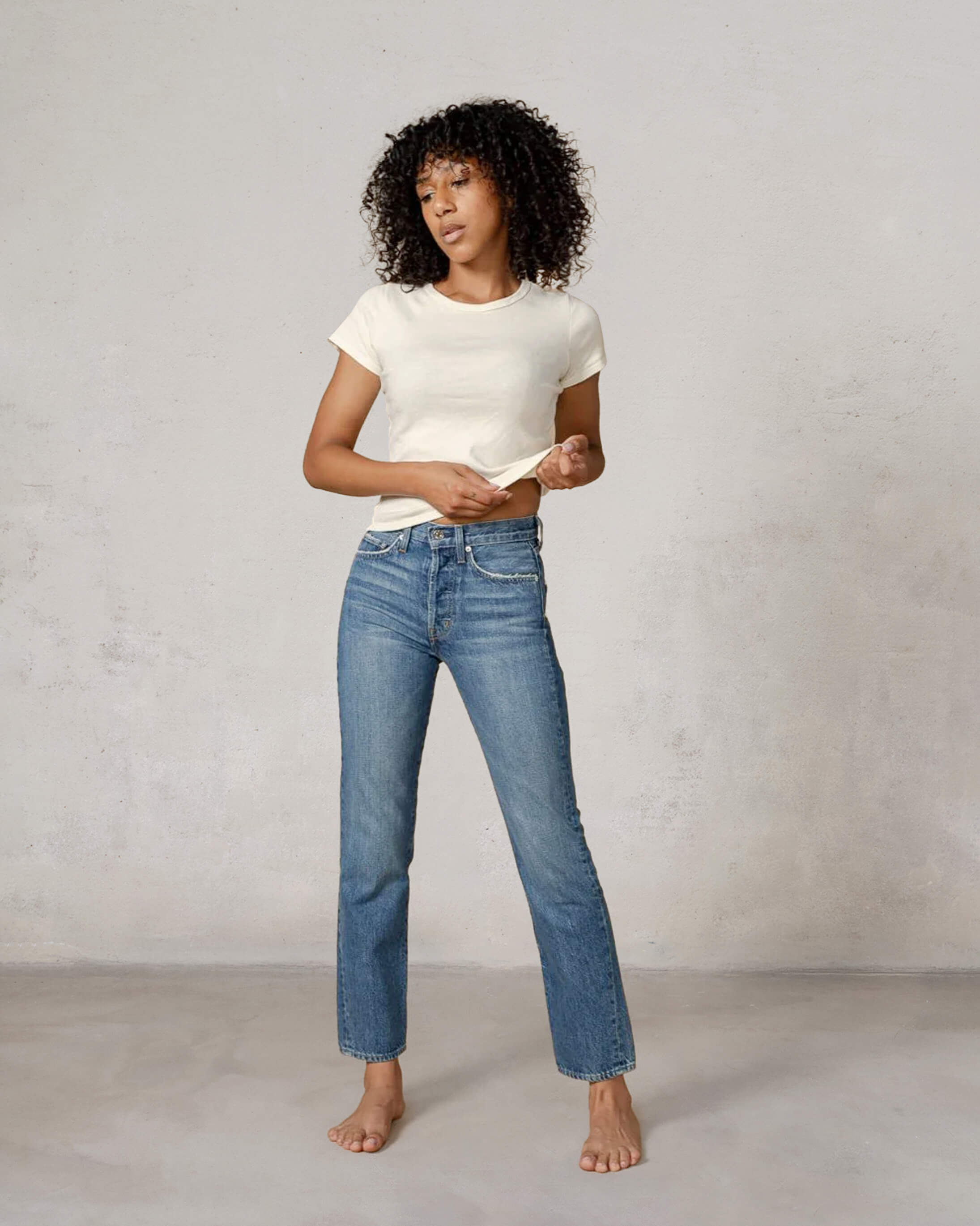 Discover the CAI in Lumineer, a stylish high-rise women's jean featuring a classic straight leg and relaxed silhouette, designed for ultimate comfort and versatility.